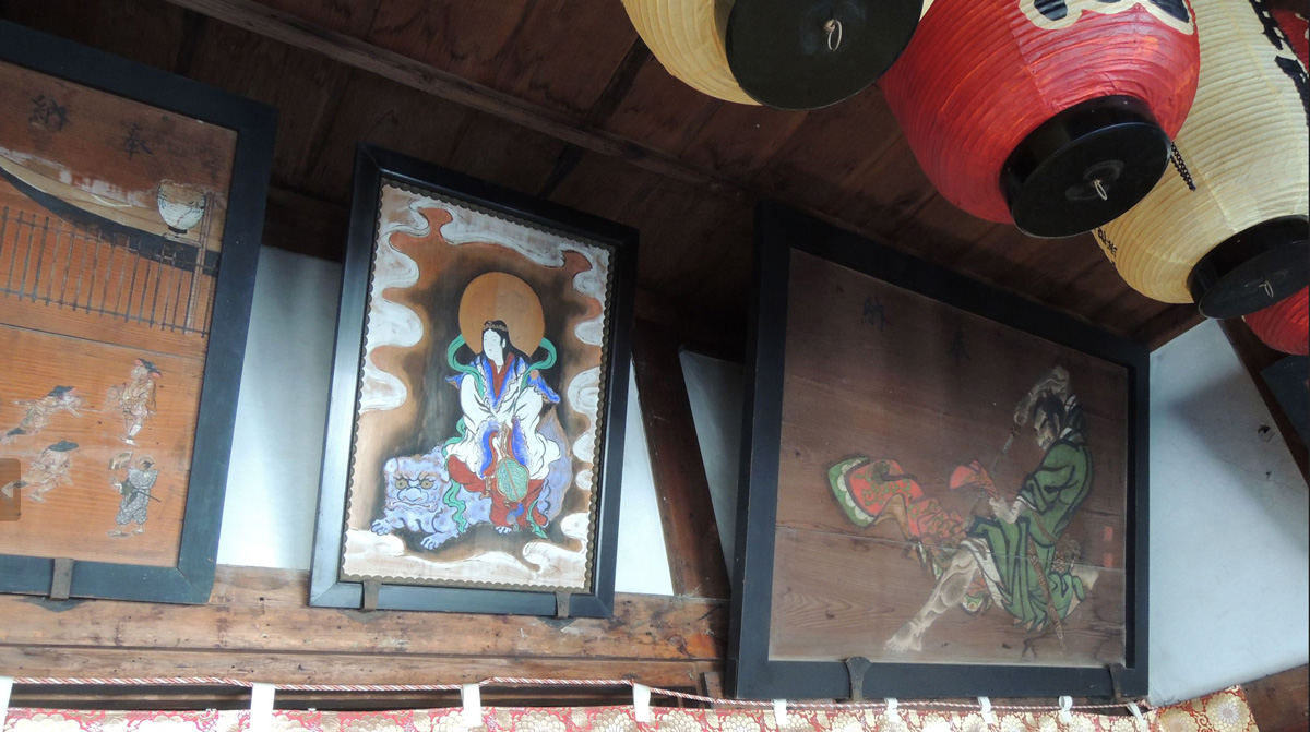 Many old historical votive pictures and frames fill up the walls of the hall