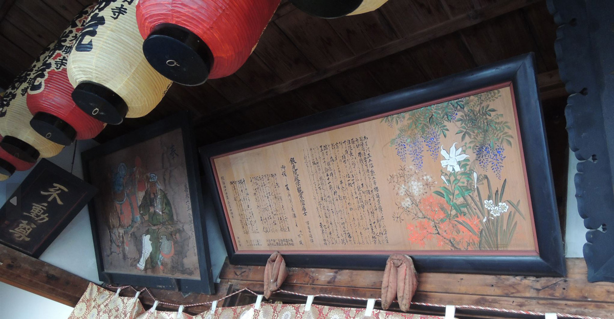 Many old historical votive pictures and frames fill up the walls of the hall