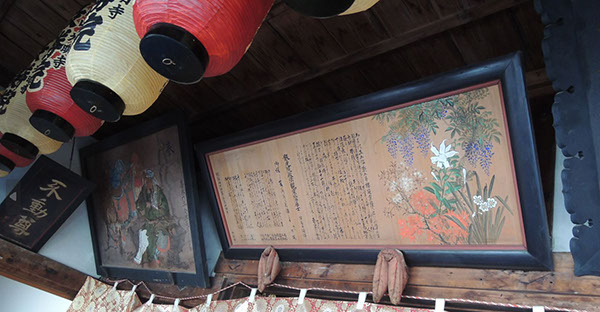 Many old historical votive pictures and frames fill up the walls of the hall