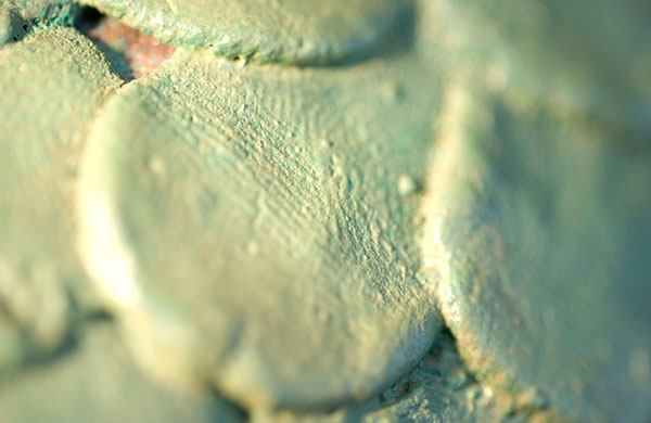 The statue is made of bronze and woven with beeswax work